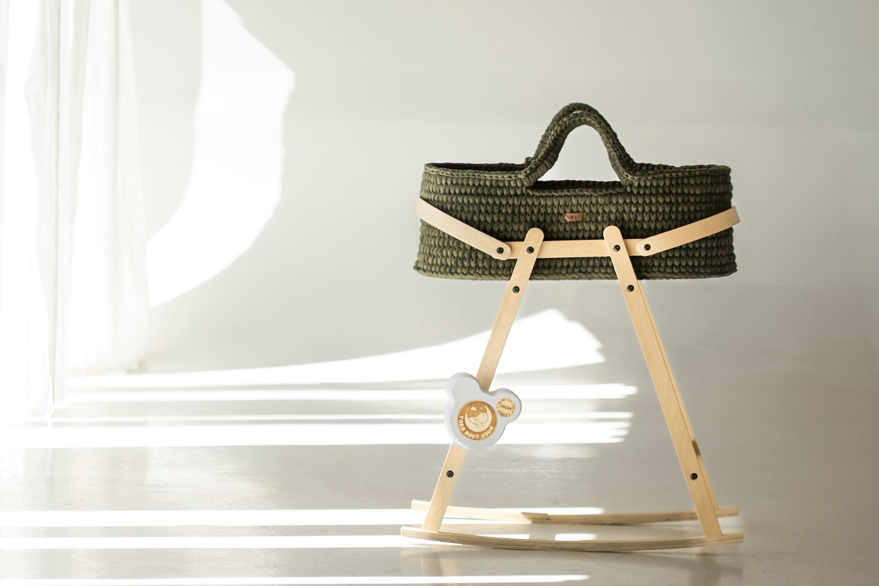 ROCK your BABY attached to a baby cradle in natural light.